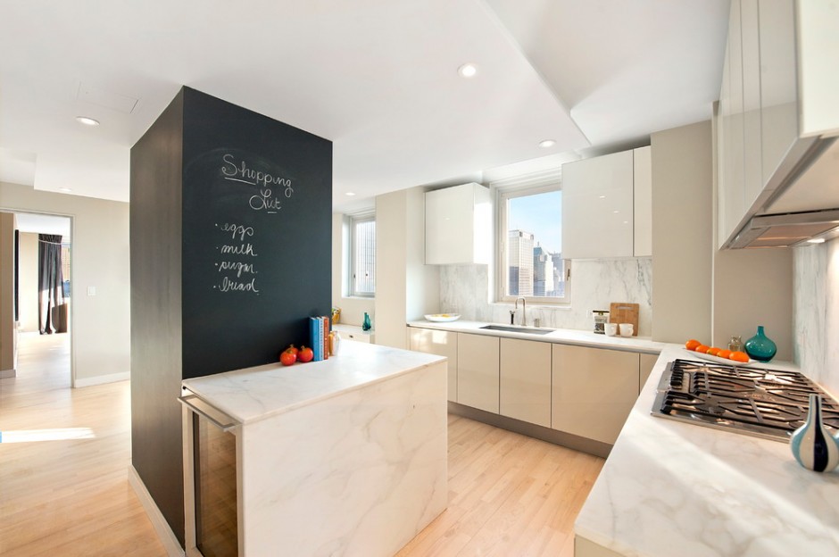 Column in the center of the kitchen decorated as a board with notes