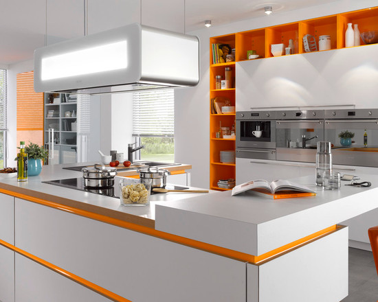 Orange decor of niches and facets in the interior of a light kitchen