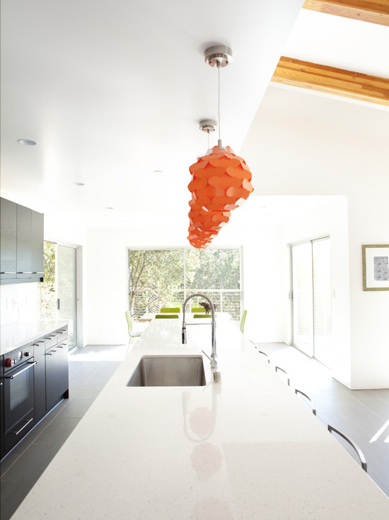 Orange chandeliers above the worktop tops