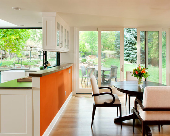 Black furniture in the interior of the kitchen is orange